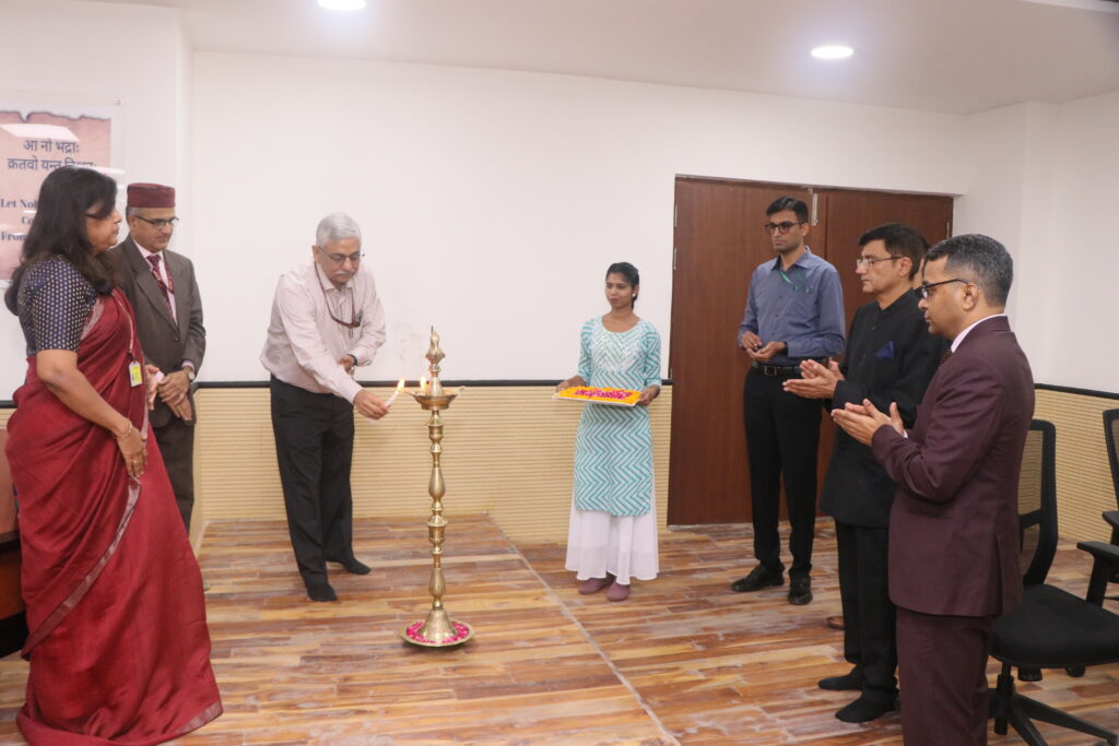 Lamp lighting ceremony - Senior officials performing traditional inauguration with brass diya